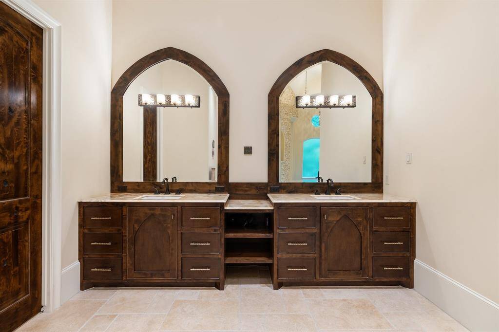 Simple elegance describes the double vanity in the primary bath.