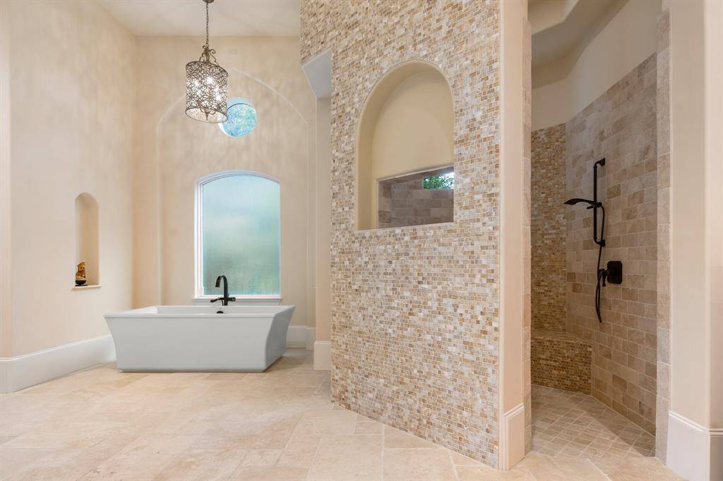 In addition, a spa like tub and over-sized walk shower complete the space.