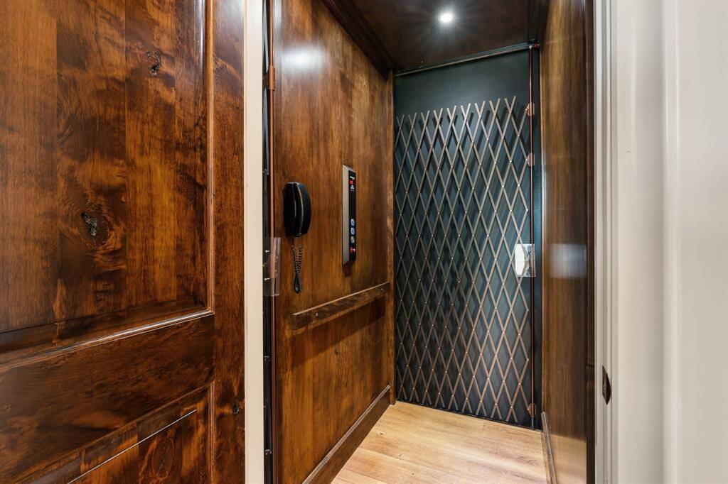 Thoughtfully designed with convenience in mind, the home includes a private elevator, ideal for effortless access to both levels.