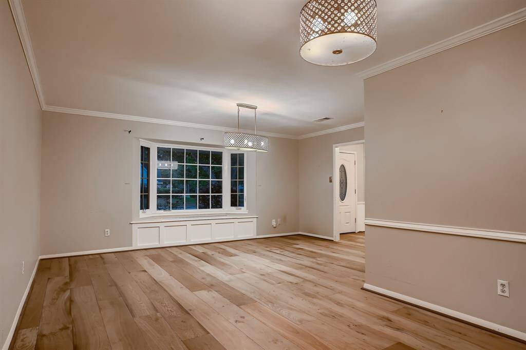 Formal dining room looking towards the bay window in the family room.