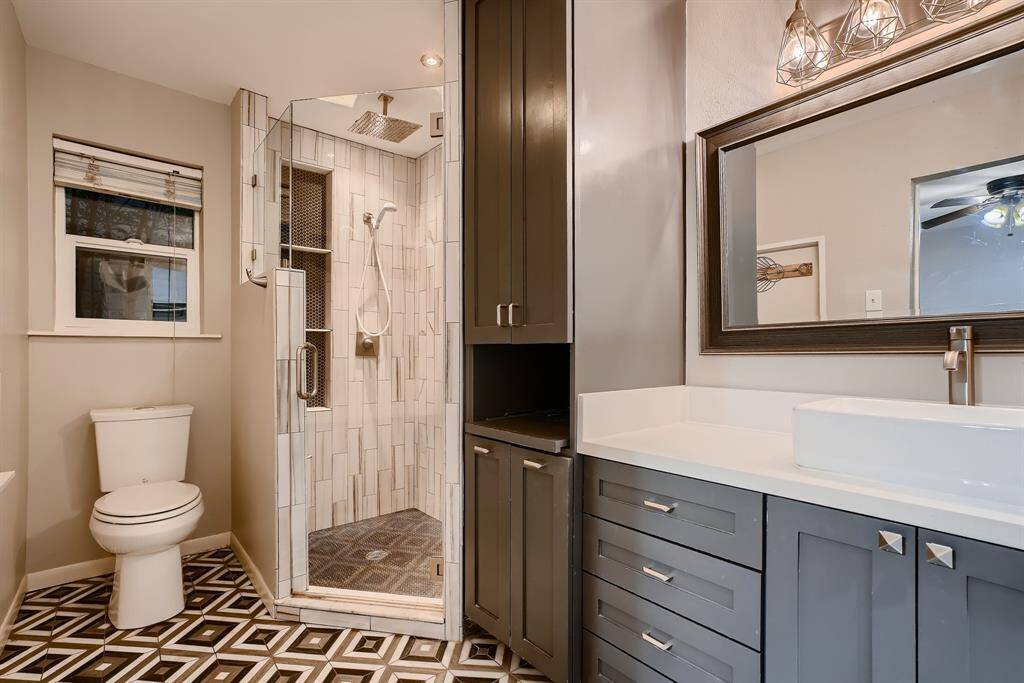 The main bath was recently updated with new cabinets, large walk-in shower, quartzite and beautiful ceramic tile.