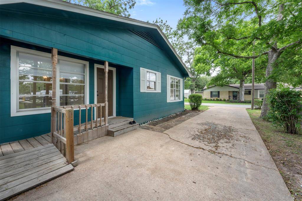 Side entrance with a private drive and quaint covered porch entry.