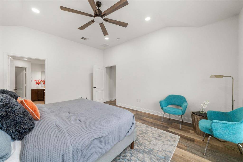 Alternate view of the primary bedroom with en-suite bathroom to your left.