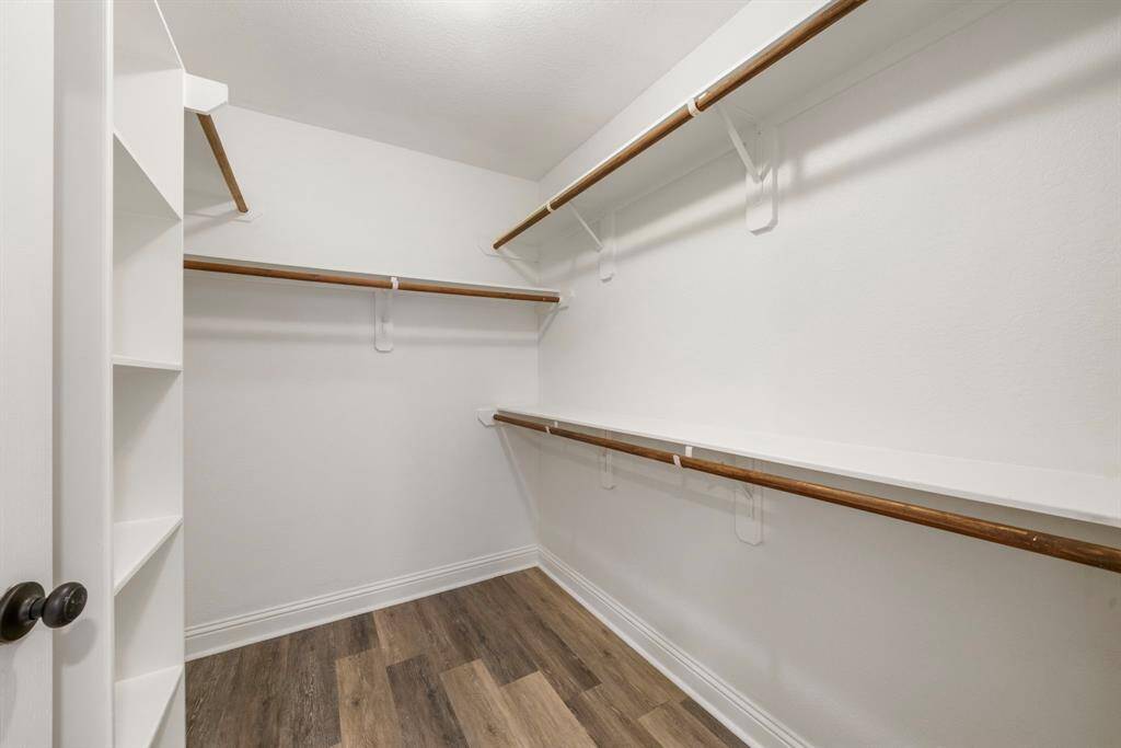 Generously sized primary bedroom closet.