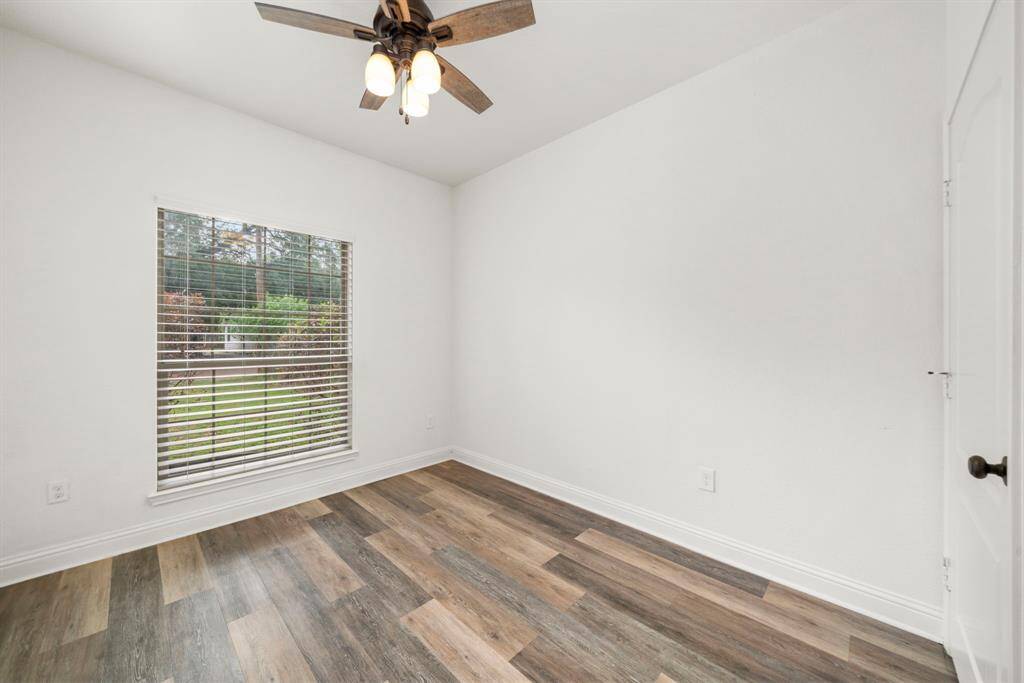 Bedroom 2 - notice that all bedrooms have solid flooring, and Ceiling Fans throughout.