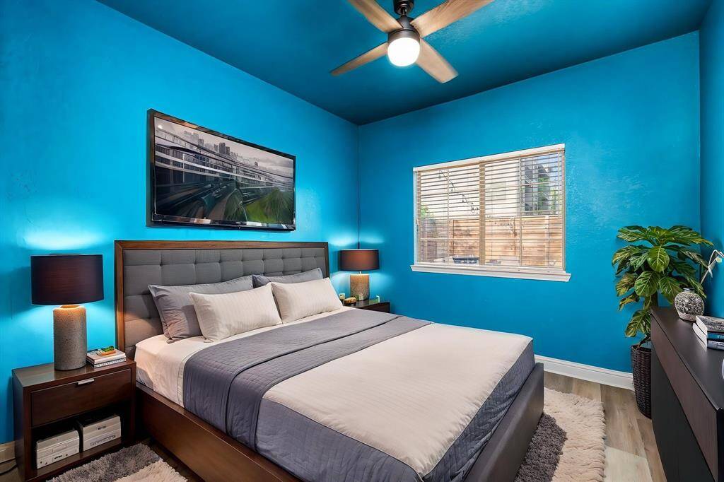 Virtually staged image of the blue room as a bedroom.