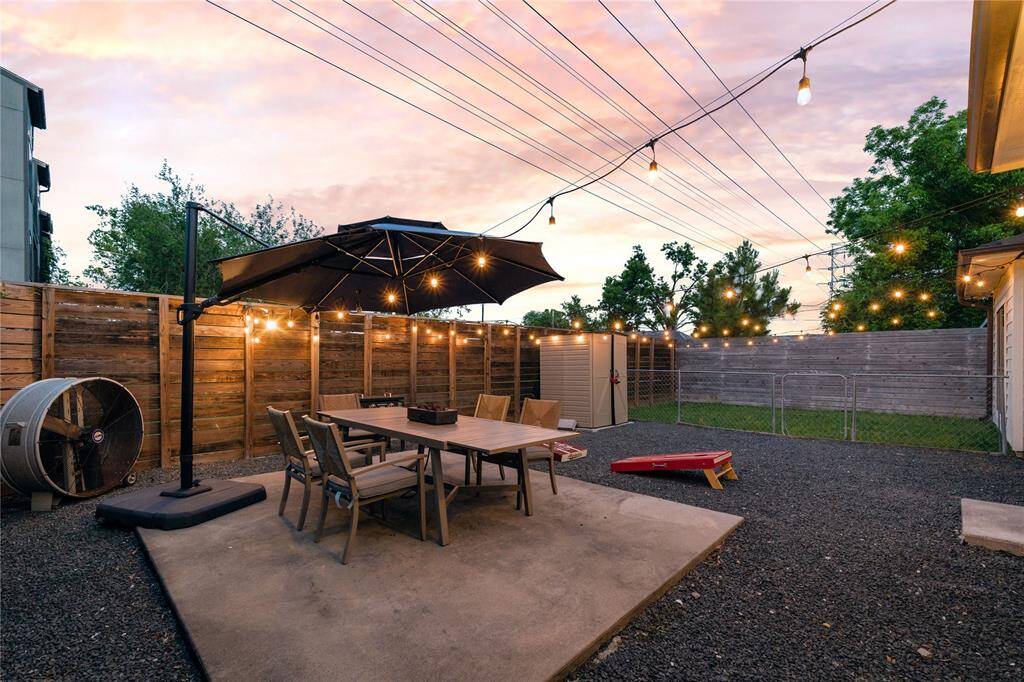 Enjoy an upgrade and entertainment ready backyard! Featuring both a hard scaped and grassy section separated by a fence, concrete deck for your outdoor dining furniture as well as plenty of room for grilling and those outdoor games!