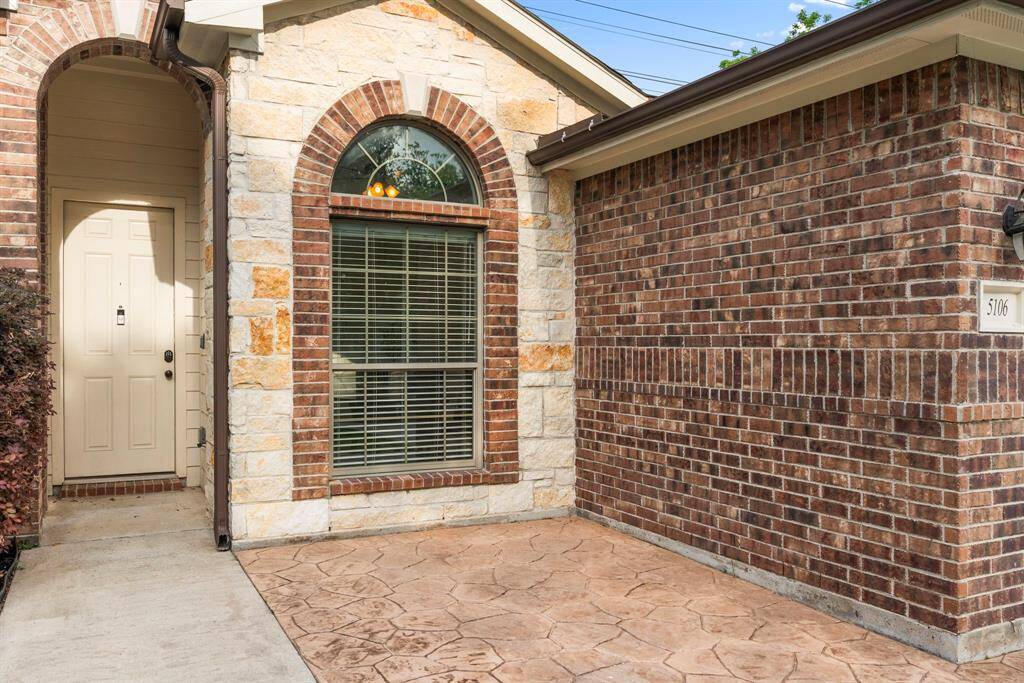 Stamped concrete patio at the entry to your home! Notice the all brick, no stucco exterior material.
