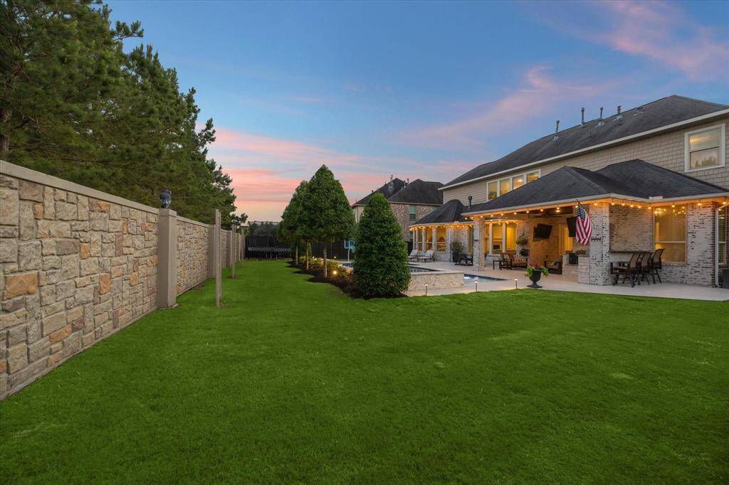 Visit with your cook and with Seating on the bar...so many places to enjoy this backyard space.