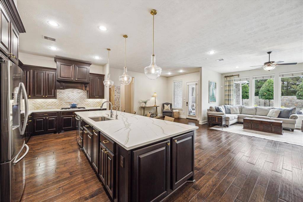 The Living, breakfast/sunroom are lined with a wall of windows capturing a fabulous view of the backyard.