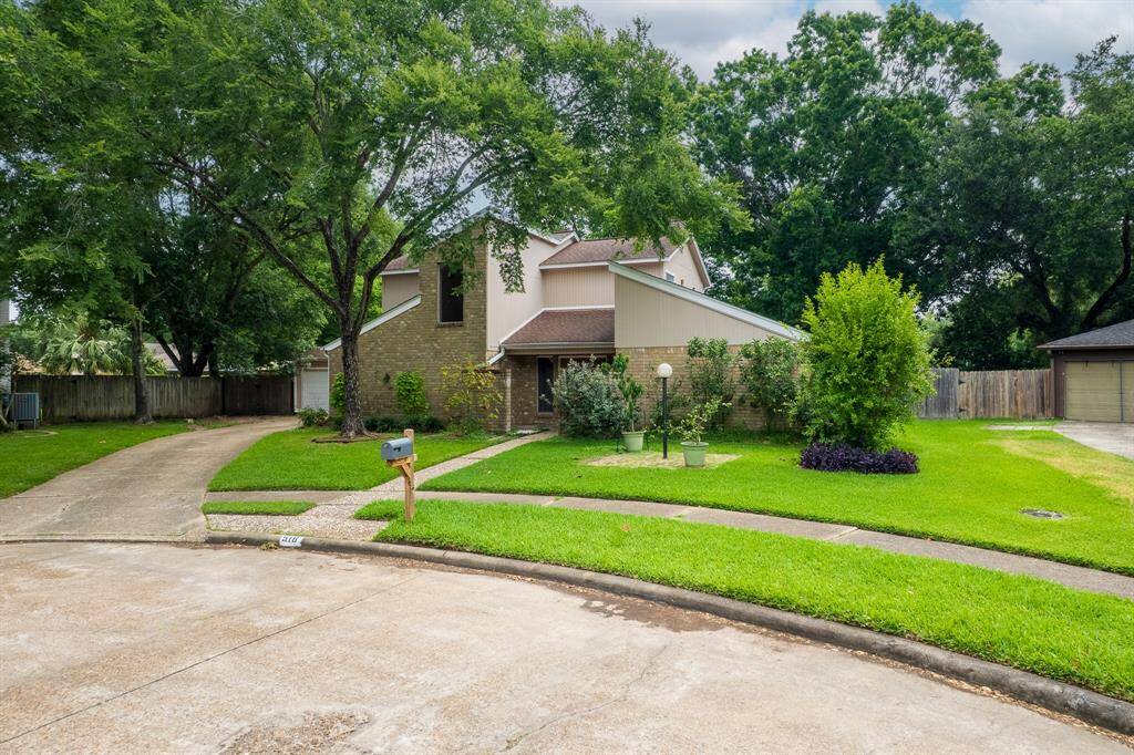 Spacious, private back yard with a partially covered patio and swim spa