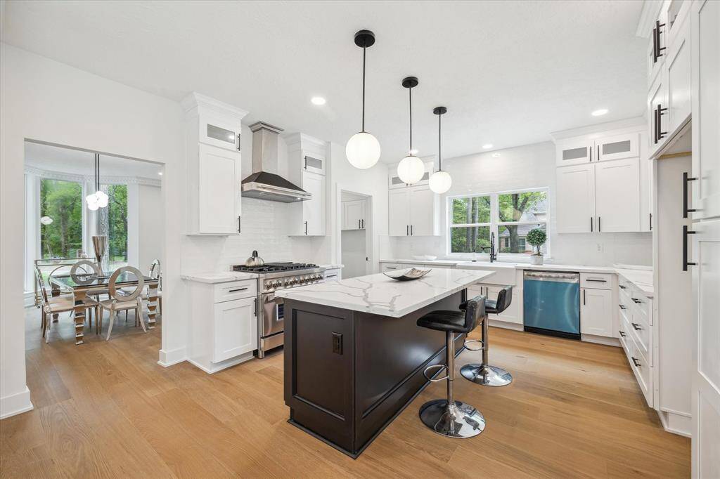 This modern kitchen is adjacent is to the dining area and a breakfast area
