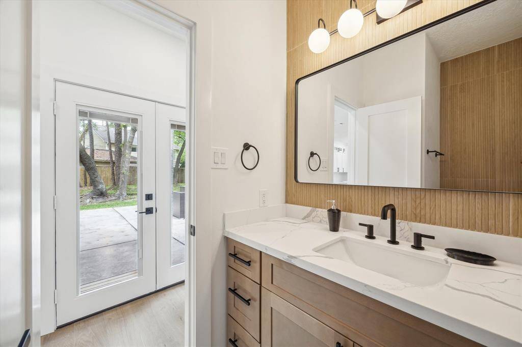Convenient half bath adjacent to the kitchen.