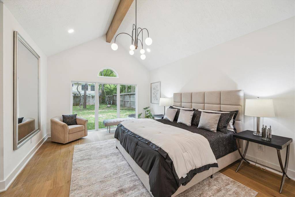 Luxurious primary suite conveniently located on the first floor, offering comfort and easy access.