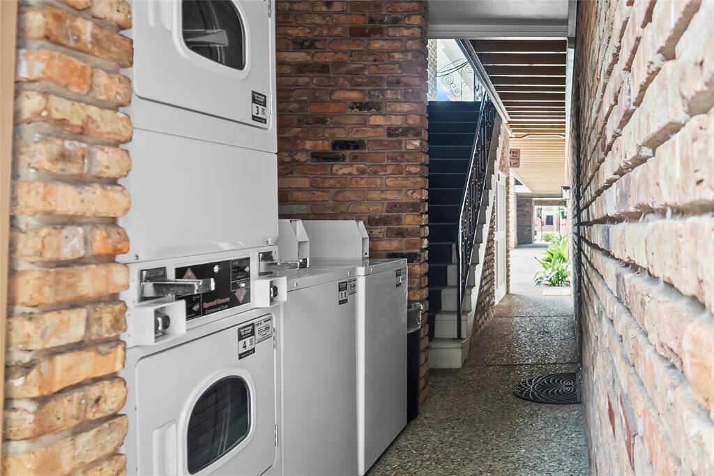 The shared laundry facility is steps away from the front door.