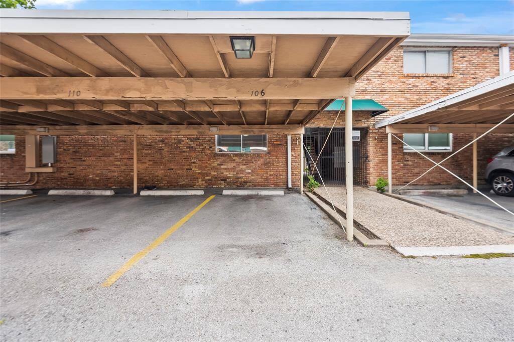 The carport is directly behind the unit. You have easy access to the unit through the pedestrian gate.