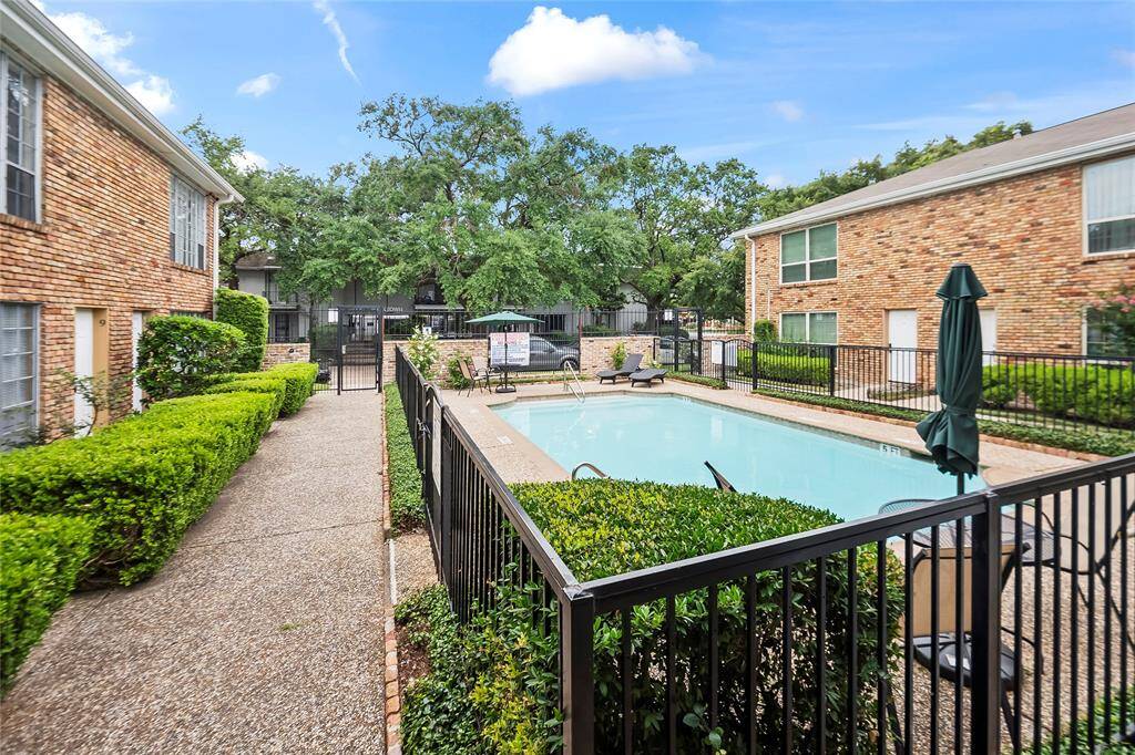 The community pool can be viewed from the unit's living room.