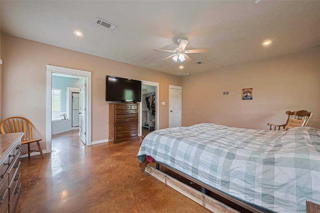 The primary suite is spacious, with an en suite bathroom and a full entry closet, creating a retreat with plenty of comfort and functionality.