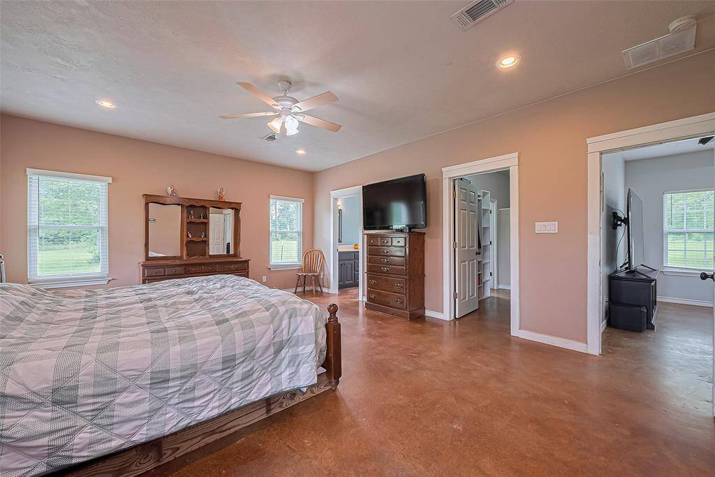 Generously sized, this bedroom comfortably accommodates large furniture and opens directly to the living area, blending privacy and access.