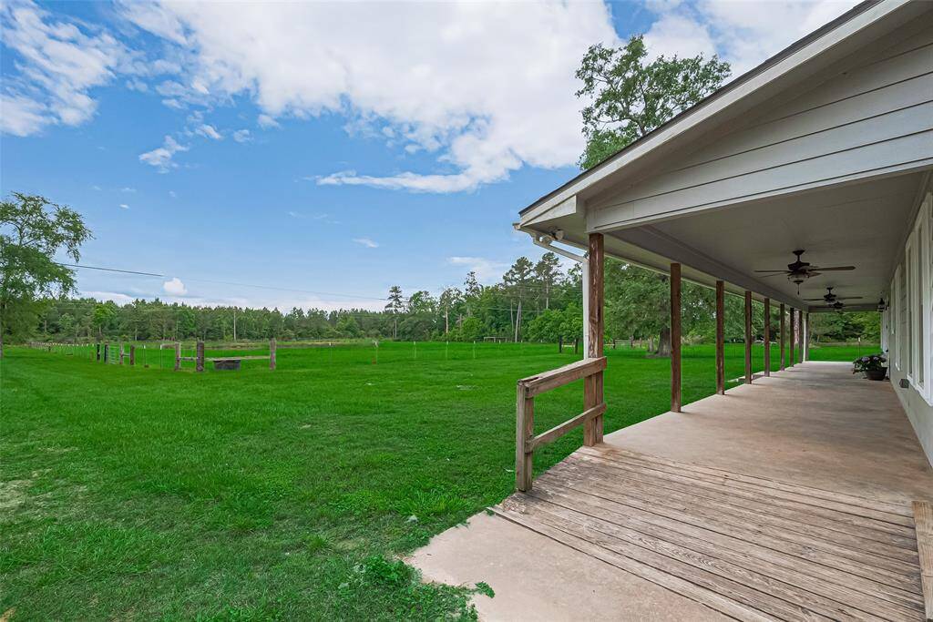Stretching from end to end, the full-length front porch offers a welcoming spot to take in the surrounding scenery.