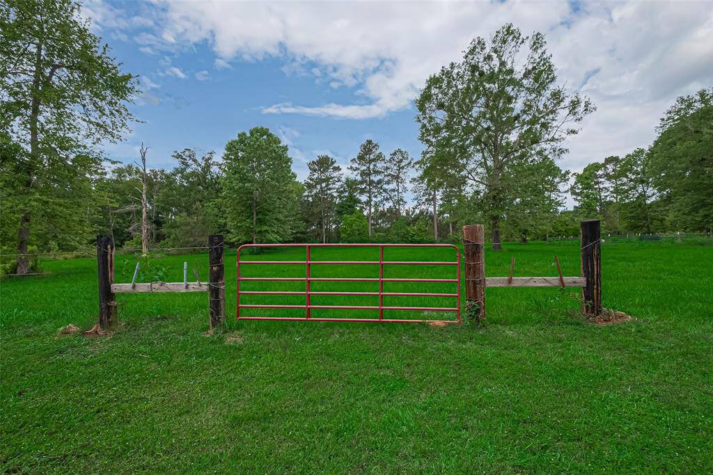 A fenced section of the land provides a ready-made setup for livestock or other rural pursuits.