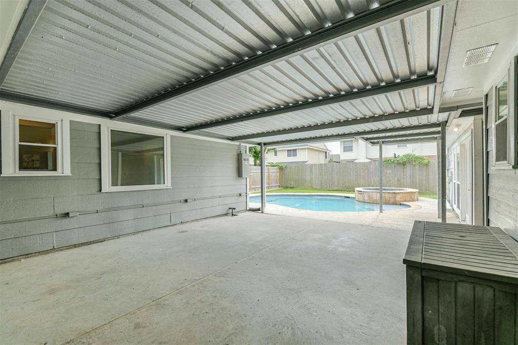 Large Covered patio connecting the main house to the guest house