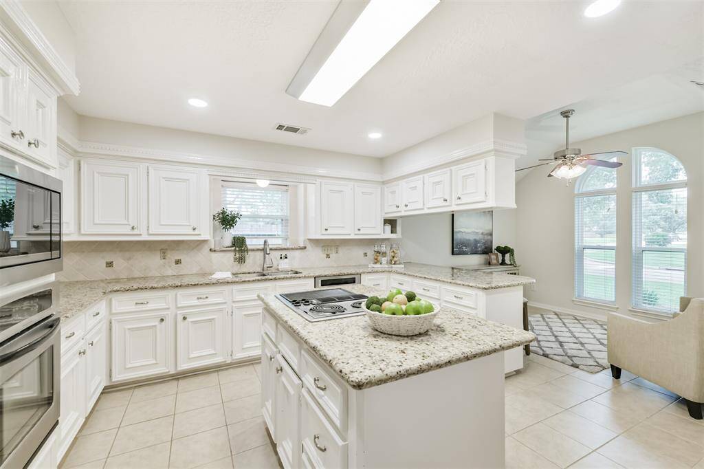 Light and Bright Kitchen open to Family and Conversation/TV Room