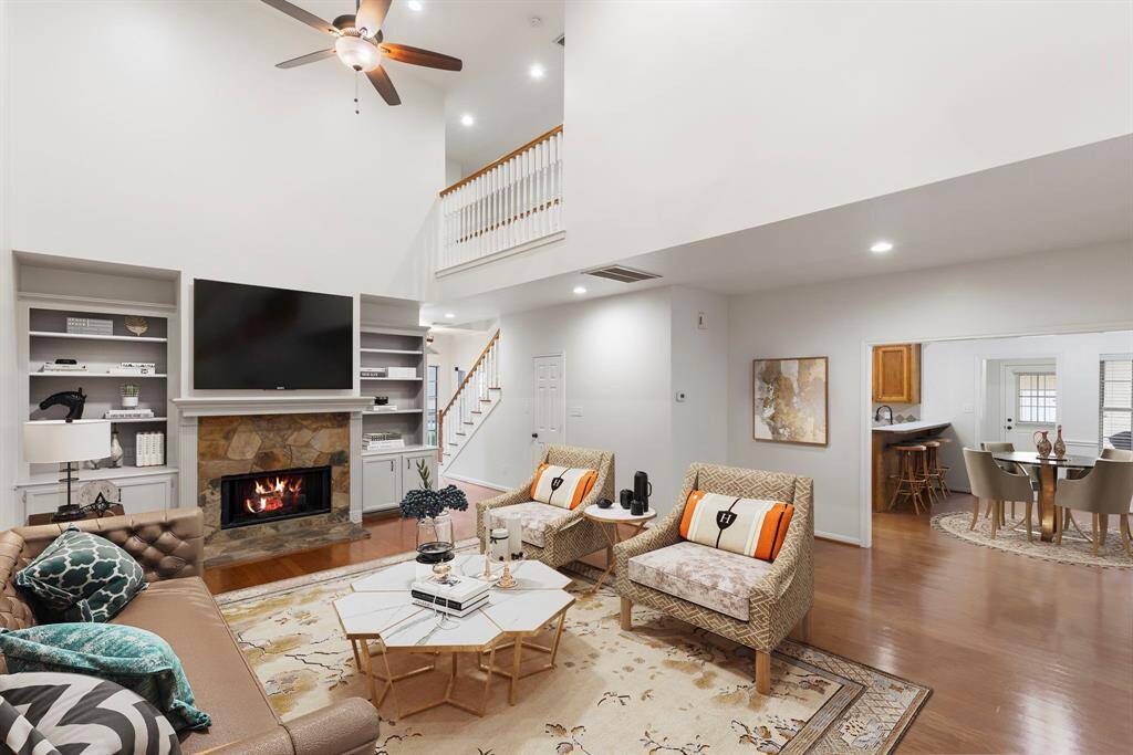 View of the family room and the breakfast area (virtually staged)