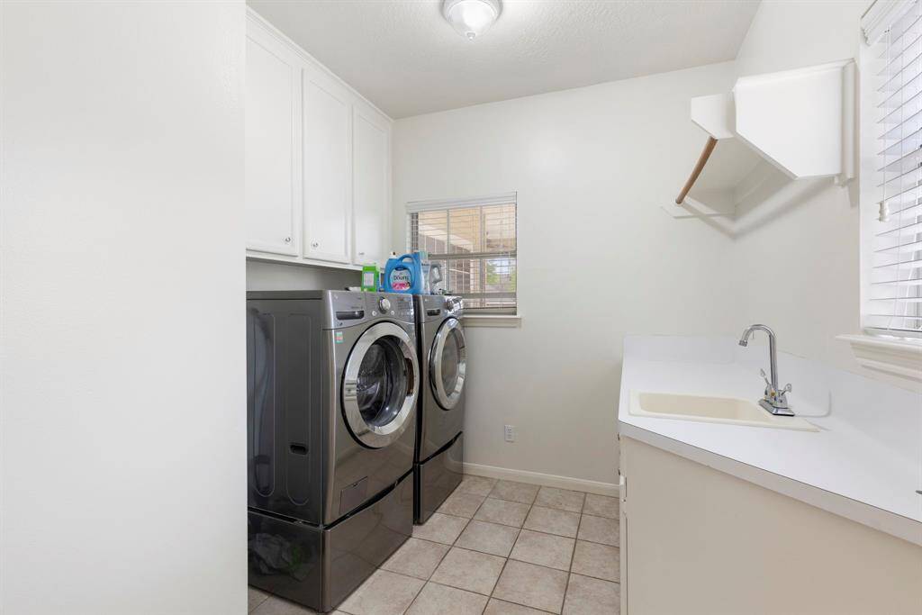 The utility room is on the first floor, and it is equipped with a utility  sink too!