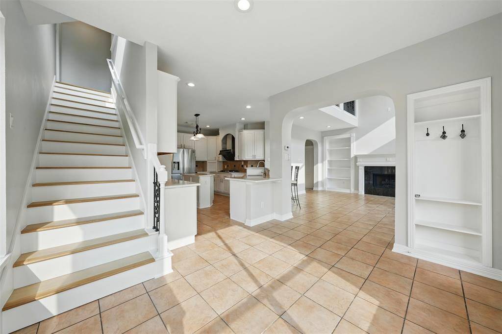 Convenient secondary staircase connecting the upstairs bedroom to the kitchen.