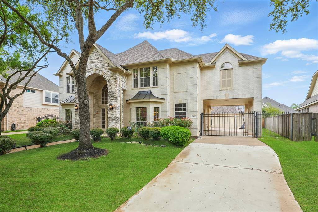 Secure and private, the gated driveway enhances your home's elegance and safety.