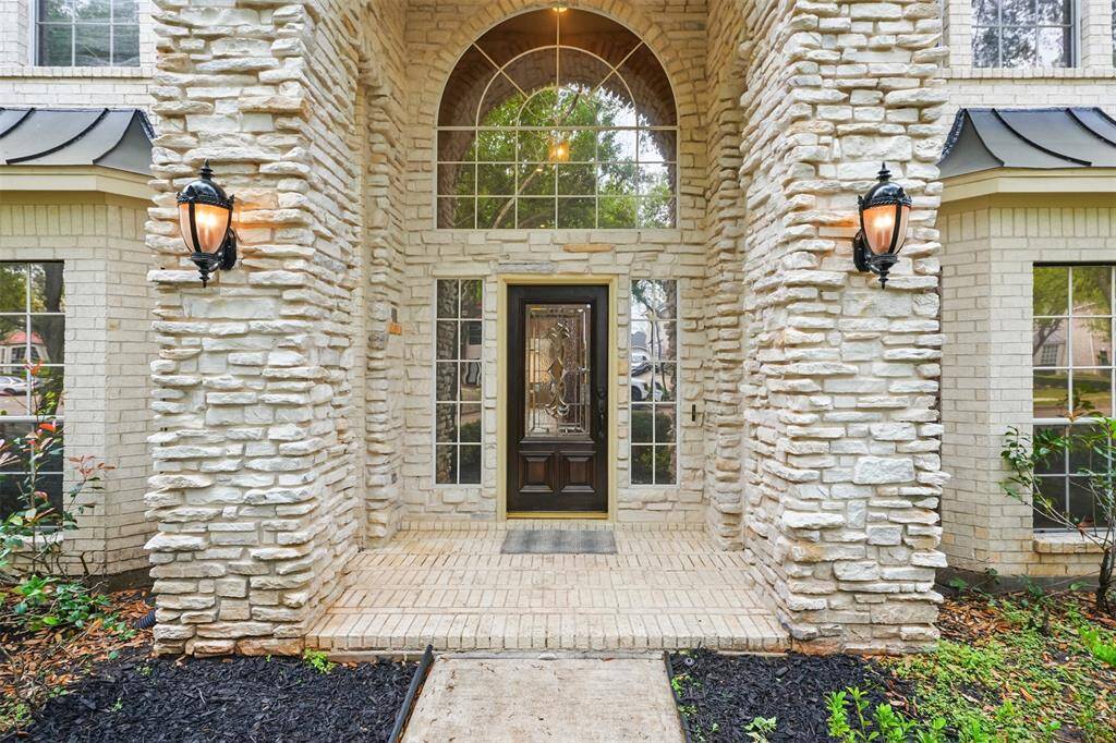 Stunning Porte-Cochere entryway welcomes you with elegance and charm.