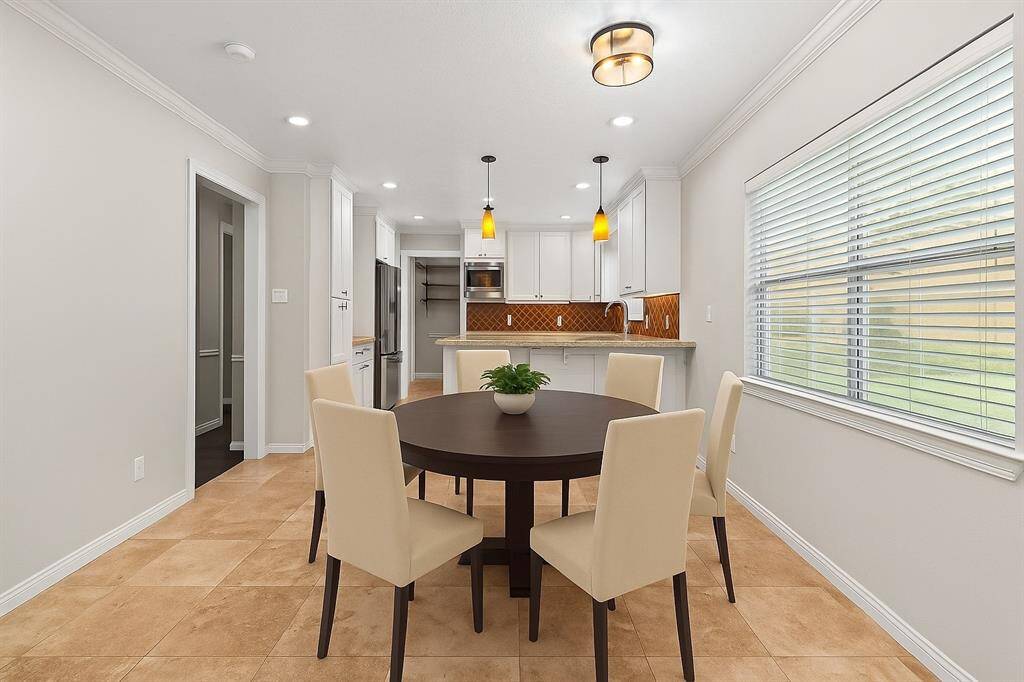 There is a breakfast room just beyond the kitchen opposite of the home office.