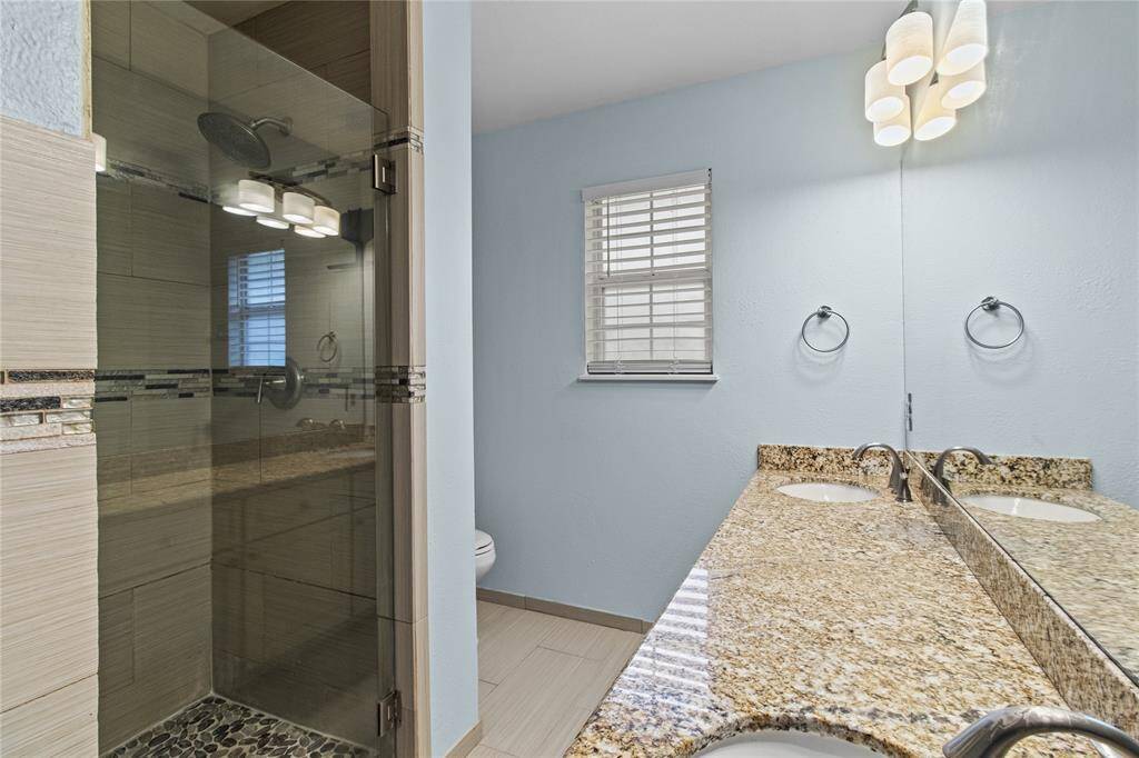 The primary has separate tub and shower.