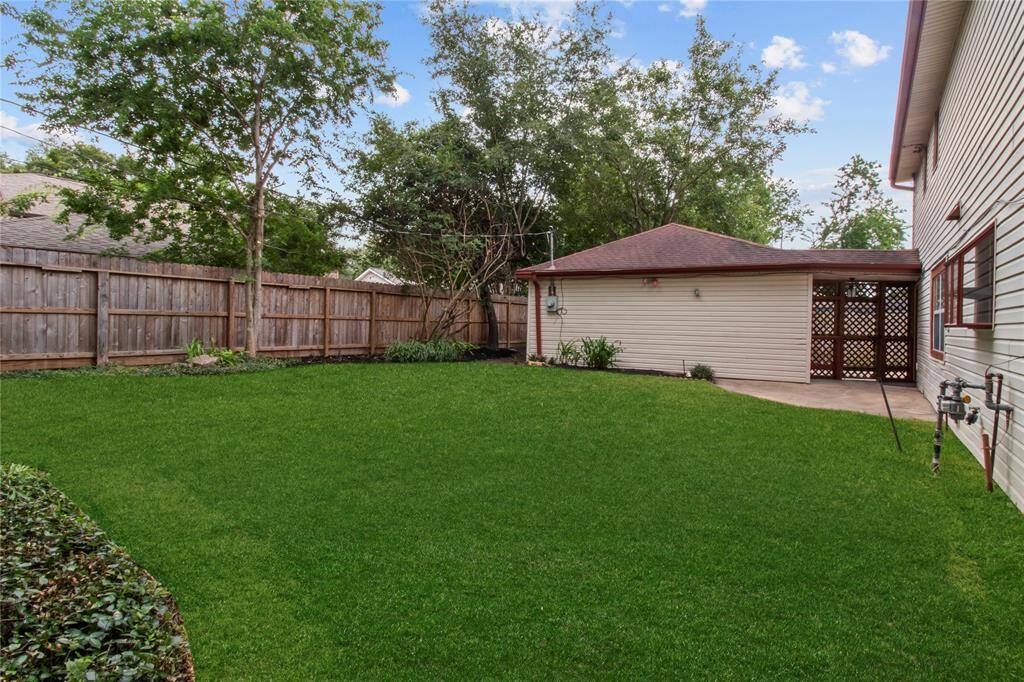 The yard is large and there is plenty of room for a pool and/or outdoor kitchen.