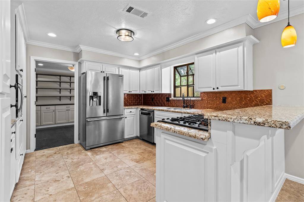 If you continue past the dining room, your reach the well appointed kitchen.