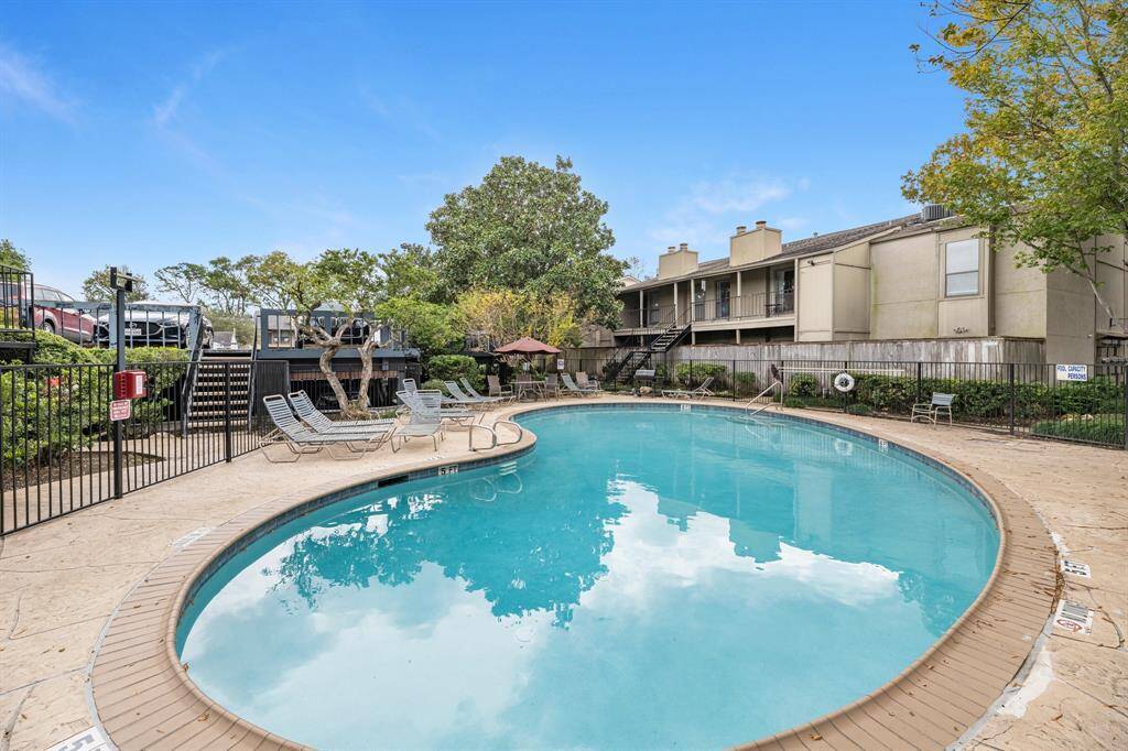 Amenities include a serene pool area with lounge chairs and a well-maintained patio, perfect for a relaxing and inviting atmosphere.