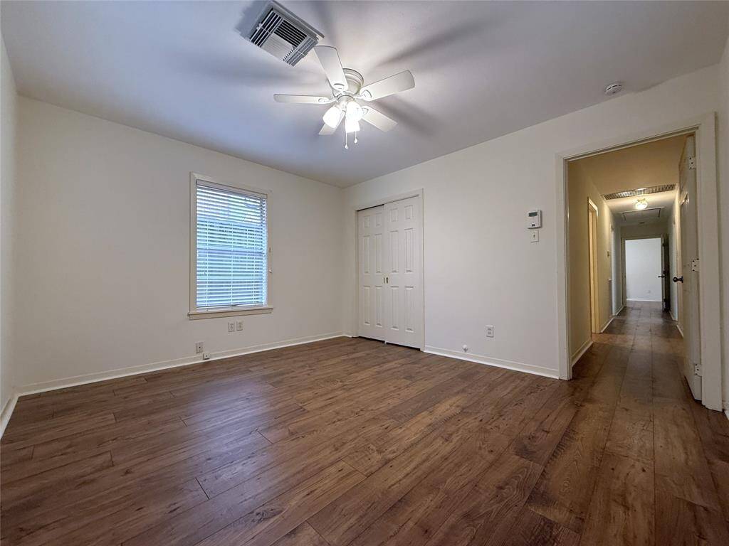 A door opens into the hallway from the back bedroom.