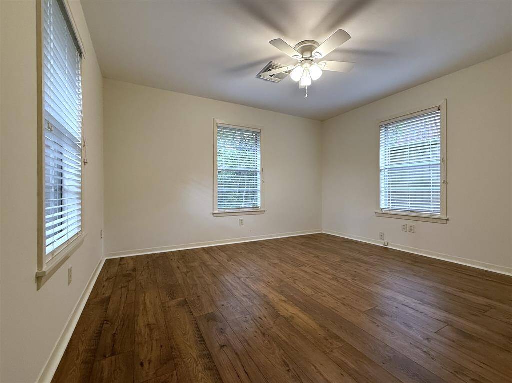 With ceiling fan, the backroom has three windows.
