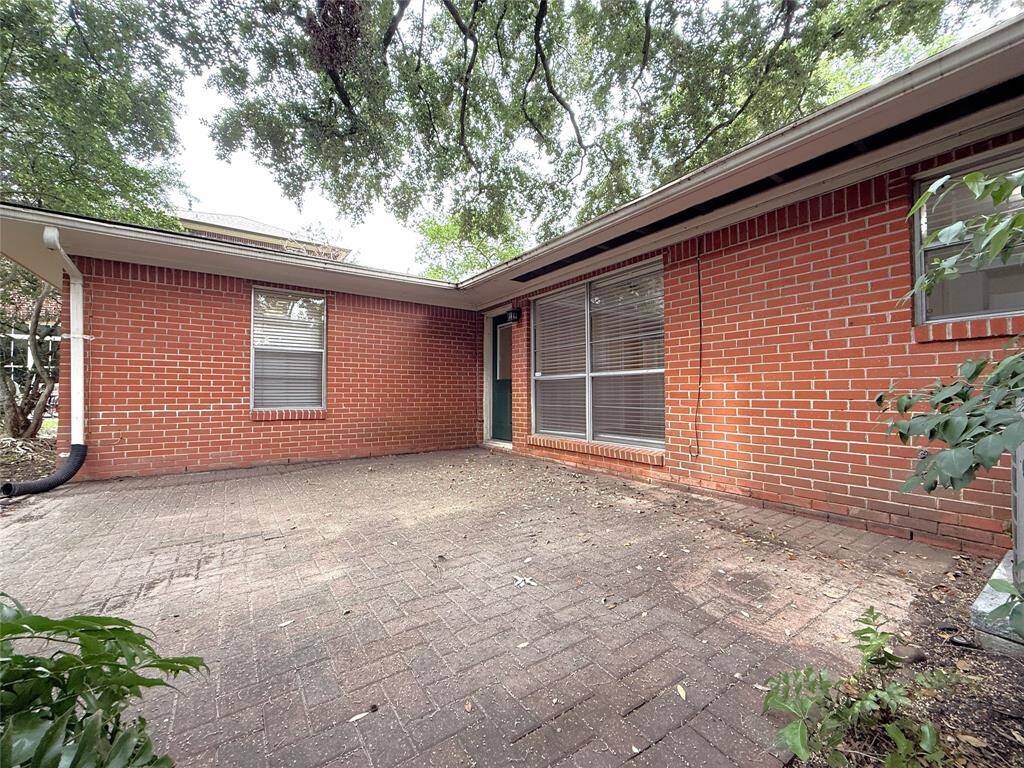 The patio offers enough space to accommodate a significant amount of furniture.