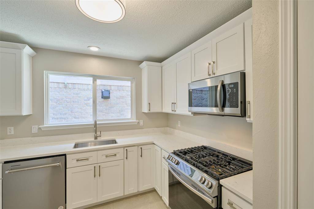 All new kitchen!! Brand new cabinetry with quartz countertops. All new appliances! Tons of storage and workspace throughout.