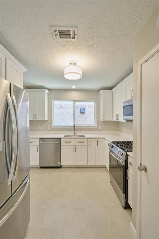 Refrigerator included with the lease.