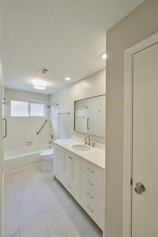 Secondary bathroom with tons of storage.
