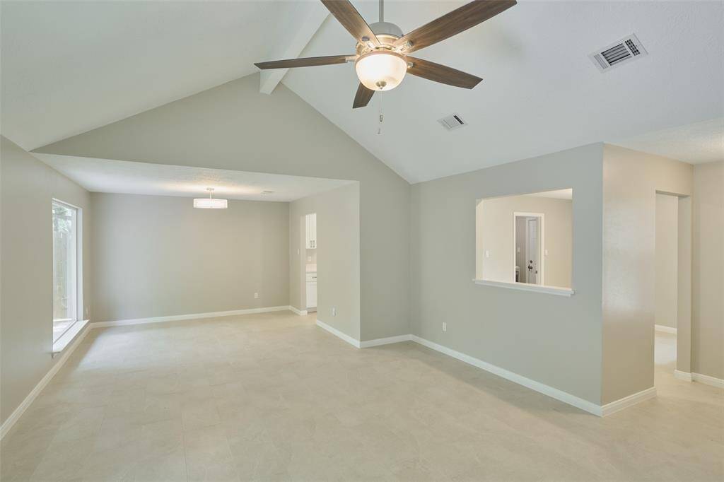 Pass through window in the kitchen area with nice flow through into living spaces.
