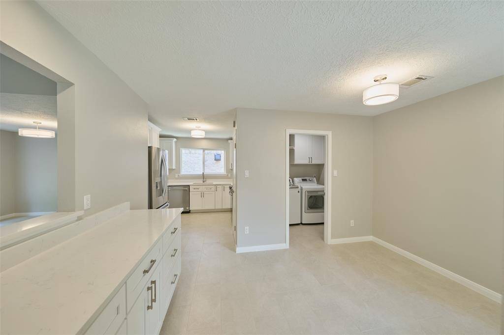 Additional storage and buffet area with pass through window. Utility off the garage with privacy door.