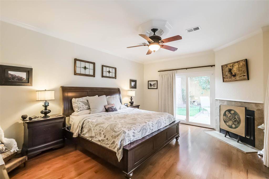 Step into the sanctuary of the primary bedroom. There are two direct access points from the primary bedroom to the patio and the hot tub/spa. Room also features a fireplace.