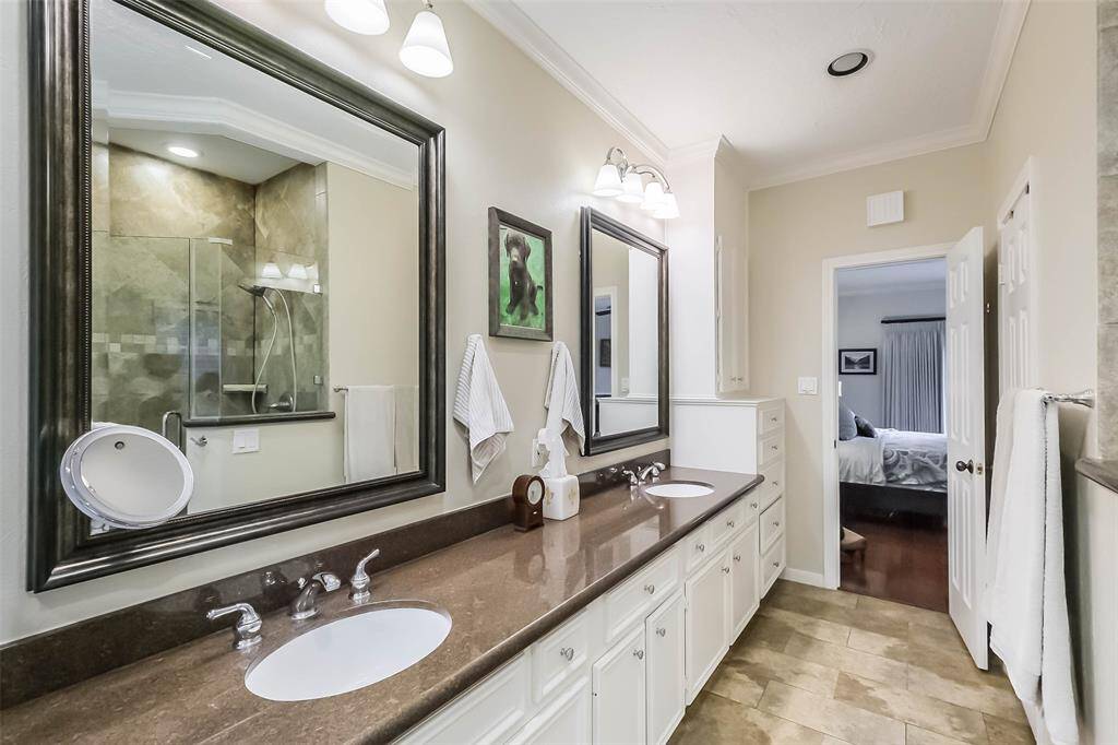 The primary bathroom has easy access to 2 walk-in closets!