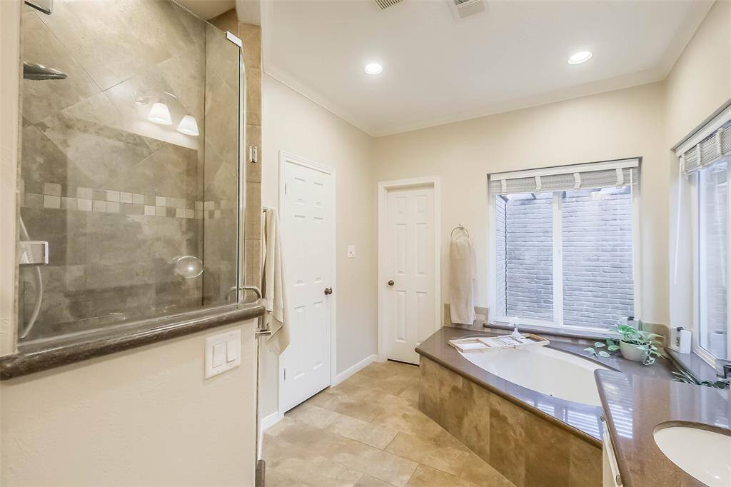 The primary bathroom also has a walk-in shower.