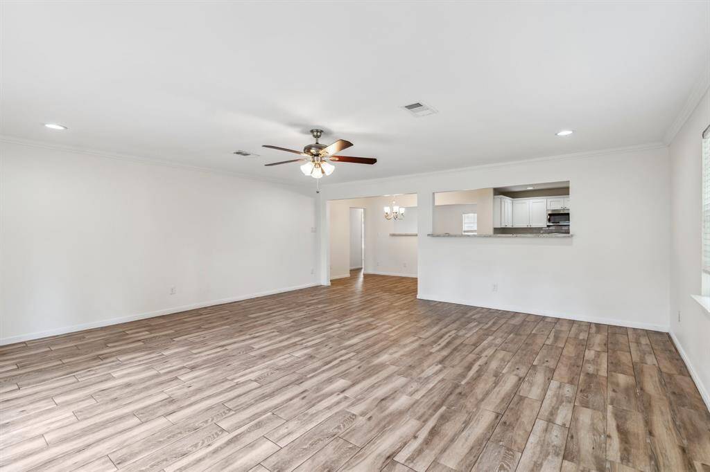 The view back toward the kitchen and dining area reinforces the open layout and easy flow. This layout makes it simple to host while staying engaged with guests across rooms.
