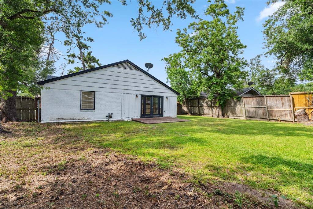 This private outdoor space offers a quiet retreat with plenty of room for entertaining or play.